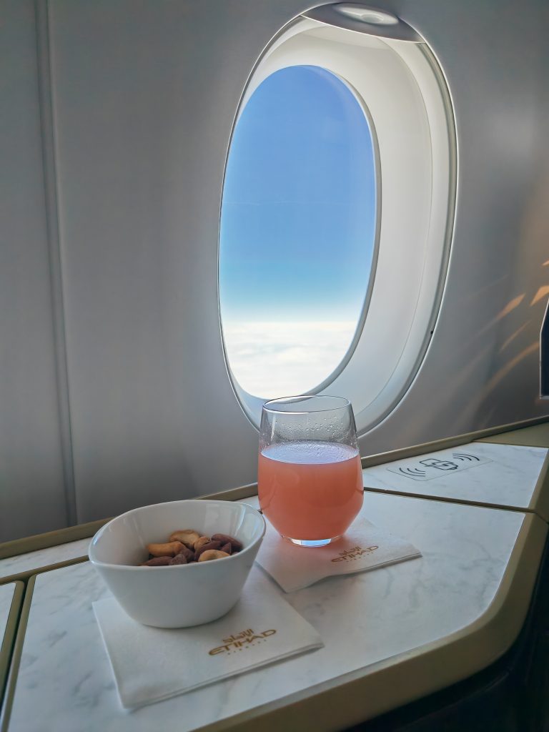 Etihad A350 Business Studio Post Take off Drink Warm nuts