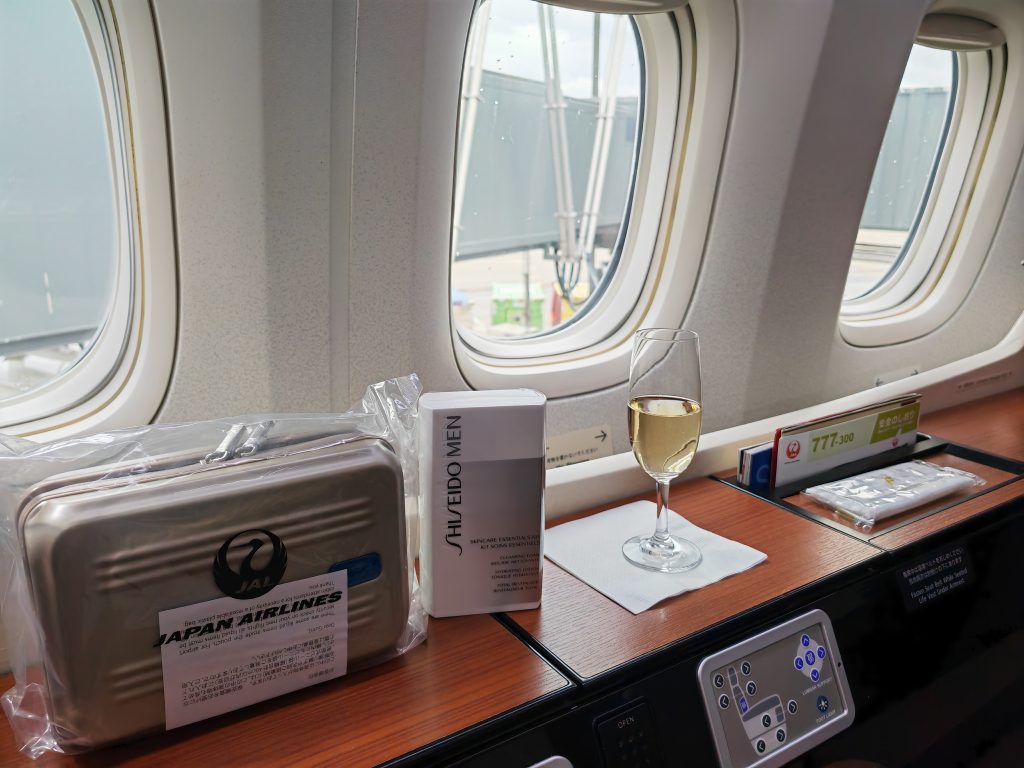 JAL First Class Amenities and Welcome Champagne