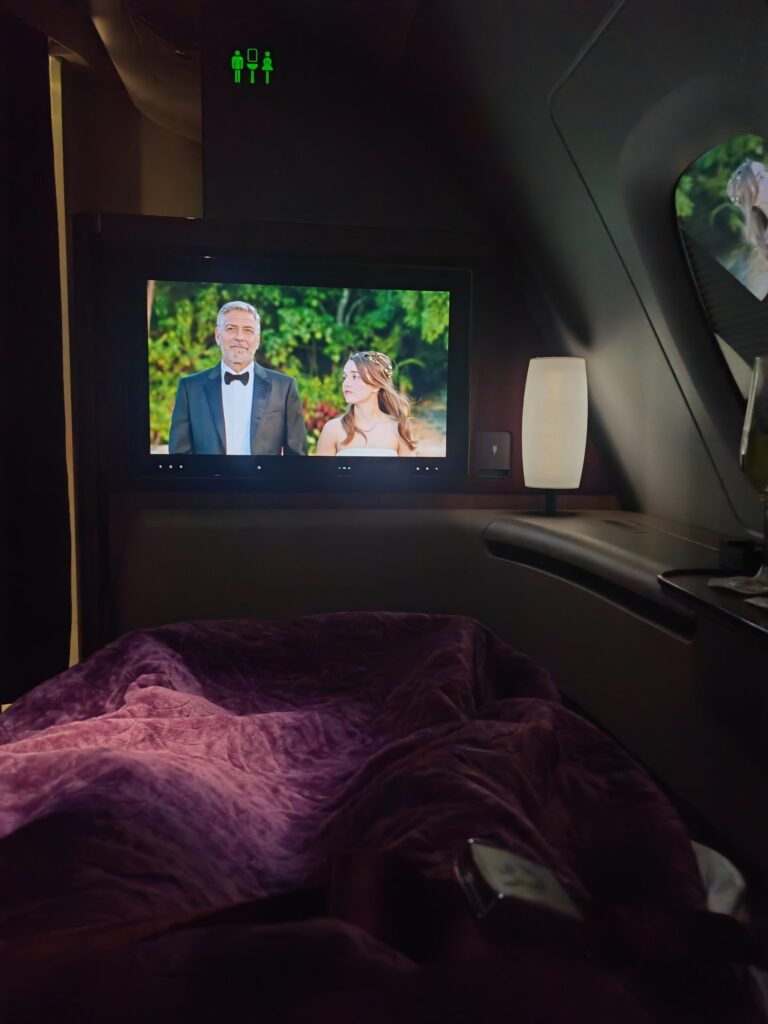 Qatar A380 First Class Enjoying A Movie in Bed